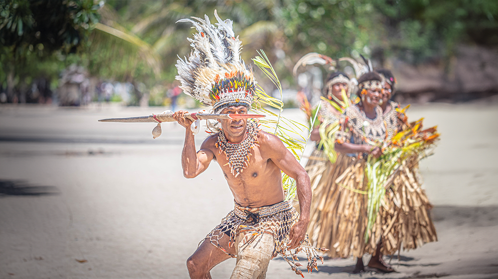 Papuan trible man welcoming visitors to Boga Boga village